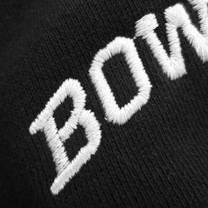 Closeup detail of white BOWDOIN embroidery.