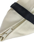 Closeup showing zippered top of tote bag.