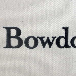 Closeup showing quality of embroidery in the word Bowdoin and the texture of the canvas fabric.