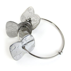 Stainless baby bangle-style rattle with 3 flat animal rattlers.