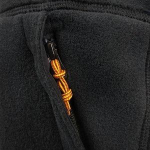 Closeup of a bootlace-style zipper pull on the front pocket.