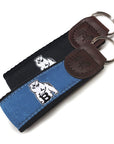 Blue and black belted cow key fobs.