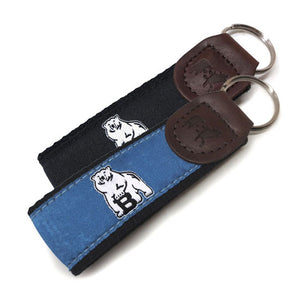 Blue and black belted cow key fobs.