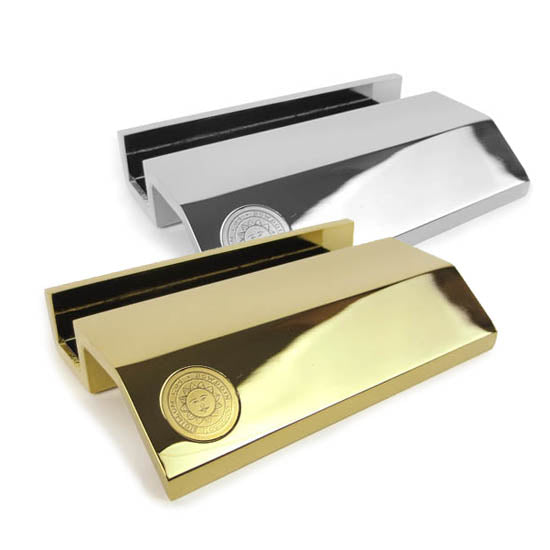 Metal business card holders in gold and silver.