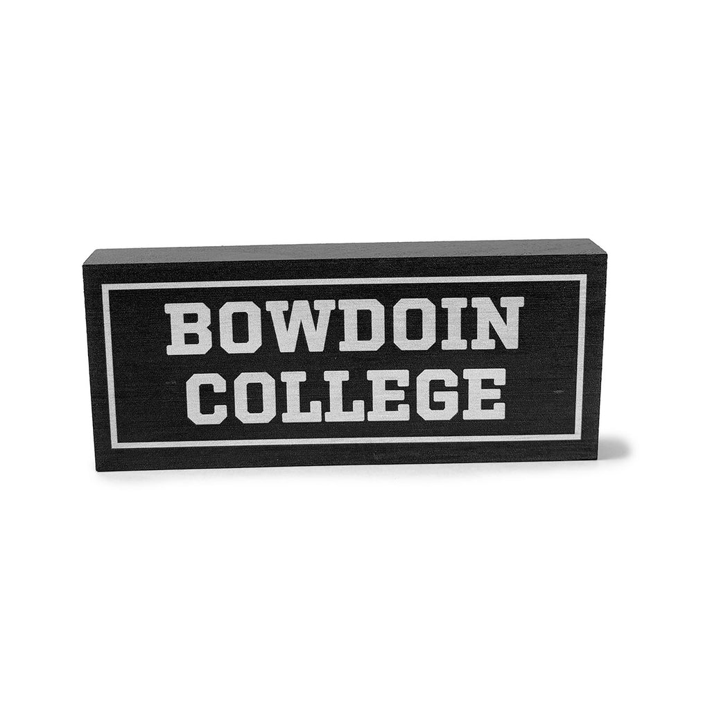 Grey wooden rectangular block with white BOWDOIN COLLEGE imprint.