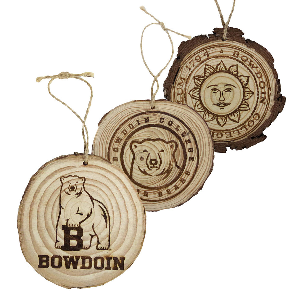 Three wooden ornaments with Bowdoin mascot, center ice medallion, and Bowdoin seal.