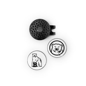 Photo of pewter-colored cap clip with magnet, and two round white ball markers with a full polar bear mascot on one side, and the polar bear mascot medallion on the other.