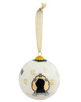 View of ornament with silhouette design of Henry W. Longfellow and gold accents on a white background