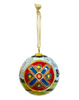 Decorative ball ornament with intricate red circular design on a white background