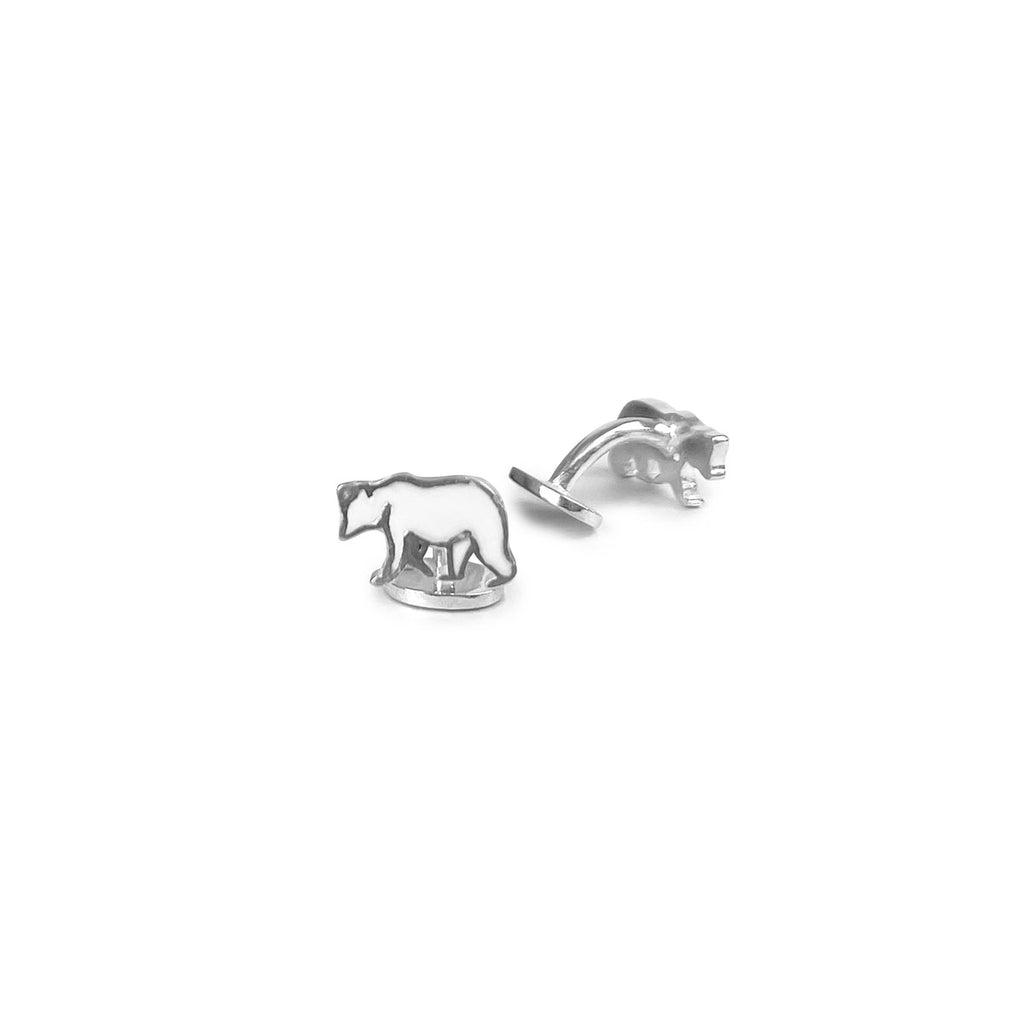 Pair of silver fixed back cufflinks with silver and white enamel polar bear fronts.