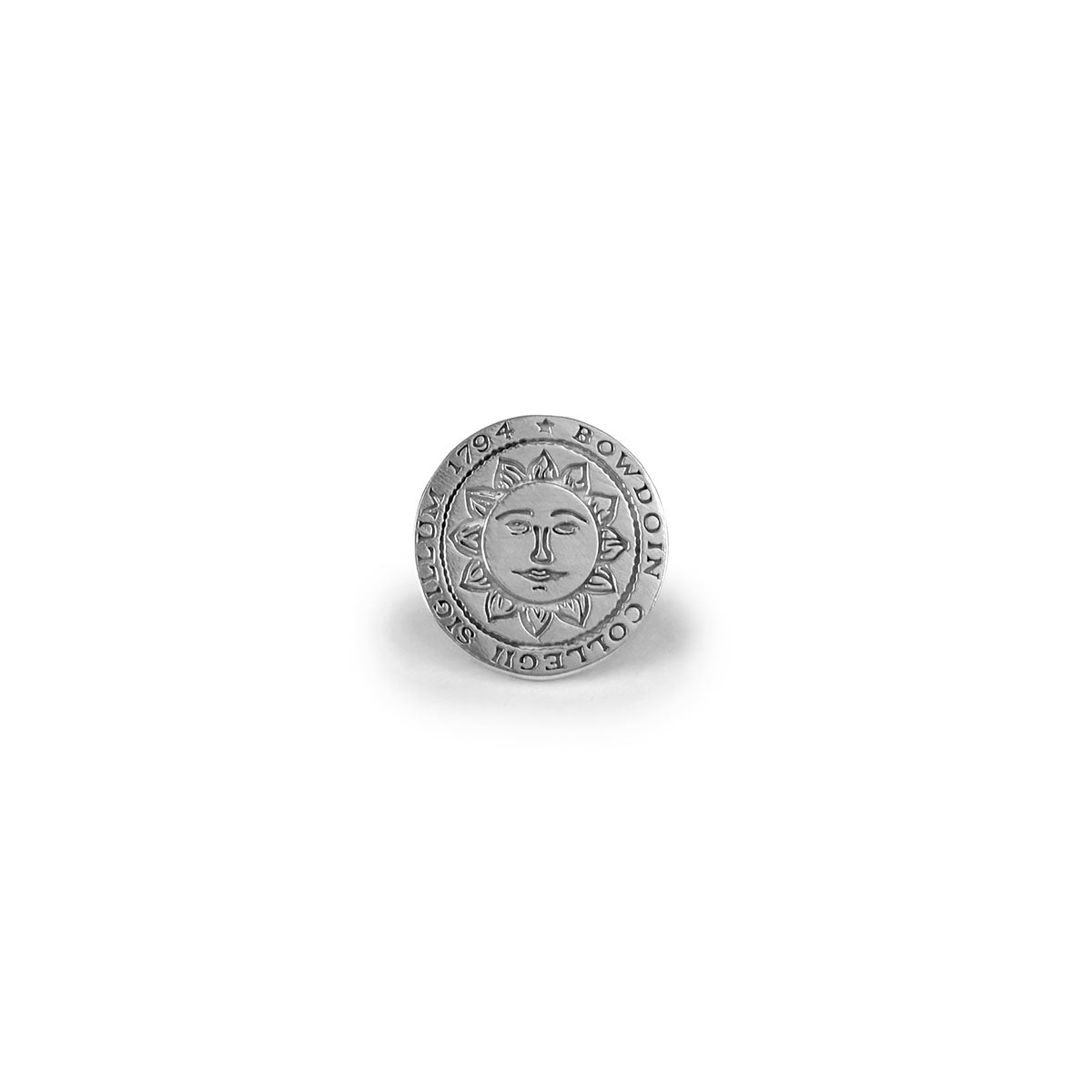Silver lapel pin with round Bowdoin College sun seal on white background.