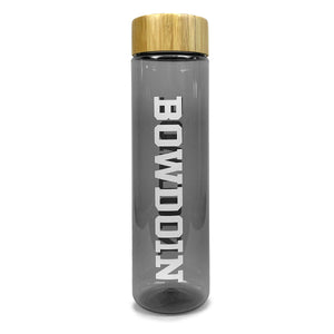 Smoke grey clear water bottle with bamboo lid and white vertical BOWDOIN imprint.