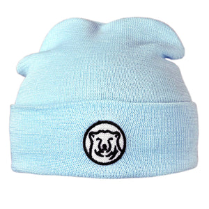 Baby blue knit baby hat with embroidered mascot medallion patch on turned-up cuff.