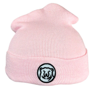 Baby pink knit baby hat with embroidered mascot medallion patch on turned-up cuff.