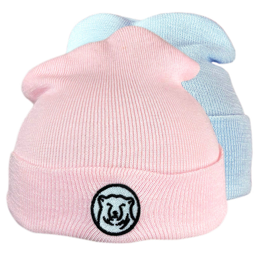 Montage of pink and blue baby hats.