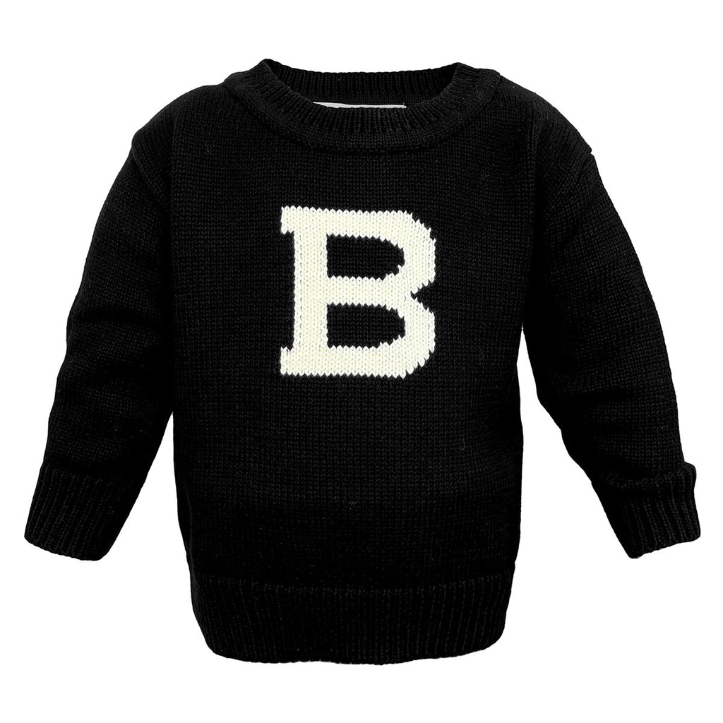 Baby black sweater with large knit-in ivory B on chest.