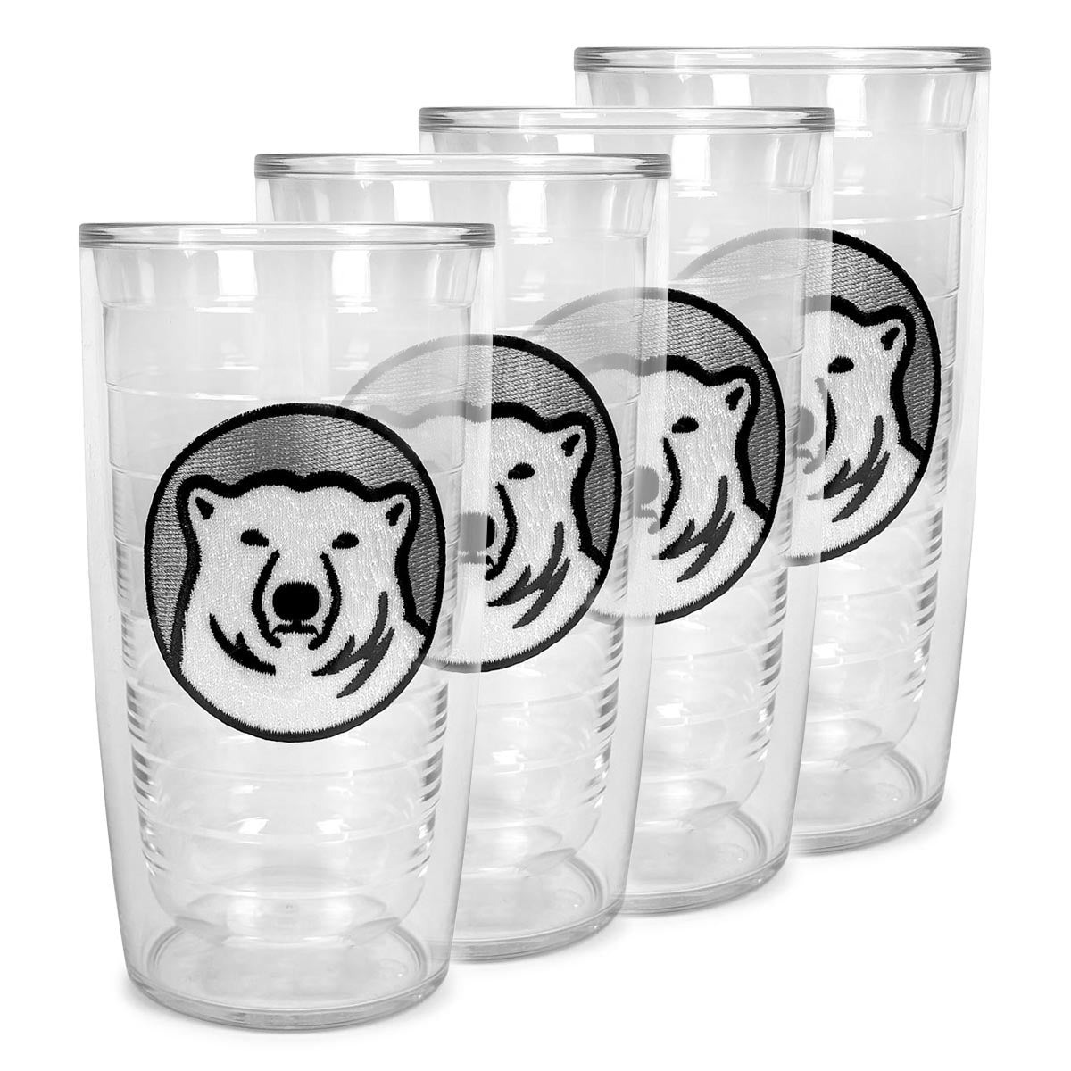 Set of clear tumblers with polar bear patches on a white background