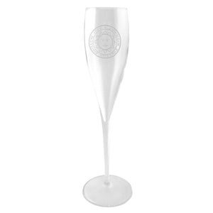 Crystal champagne flute with engraved Bowdoin sun seal.