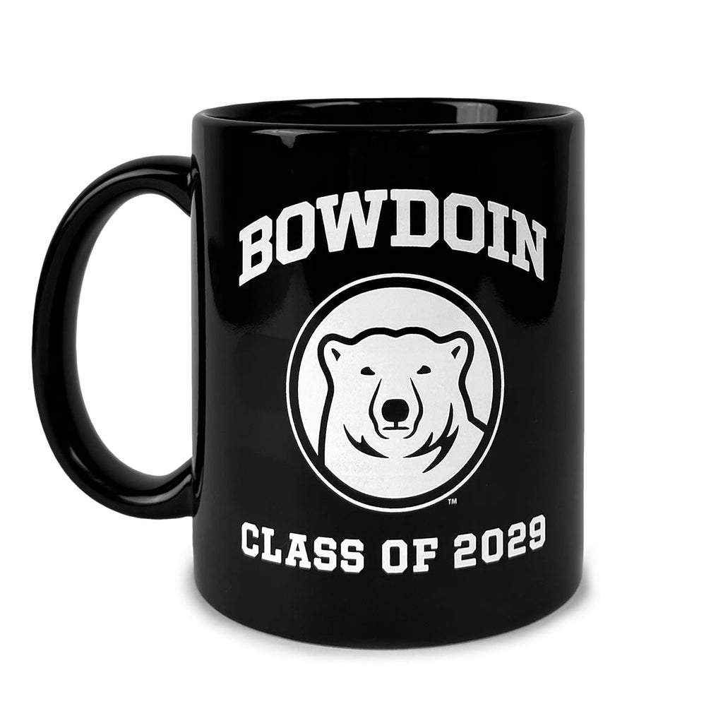 Black c-handle coffee mug with white imprint of BOWDOIN arched over a polar bear medallion over CLASS OF 2029