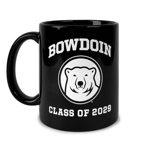 Black c-handle coffee mug with white imprint of BOWDOIN arched over a polar bear medallion over CLASS OF 2029