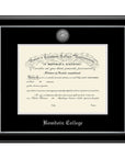 Diploma frame with glossy black moulding with silver fillet and black and silver matting. Silver sun seal medallion set into the mat on top of the diploma, BOWDOIN COLLEGE embossed in silver below.