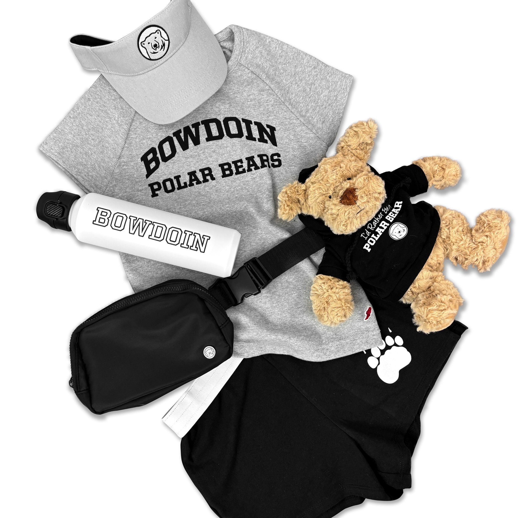 A flat lay of a clothing and gifts bundle for Bowdoin Polar Bears, including a gray t-shirt, black shorts, a black fanny pack, a white water bottle, a gray visor, and a brown plush dog wearing a black shirt.