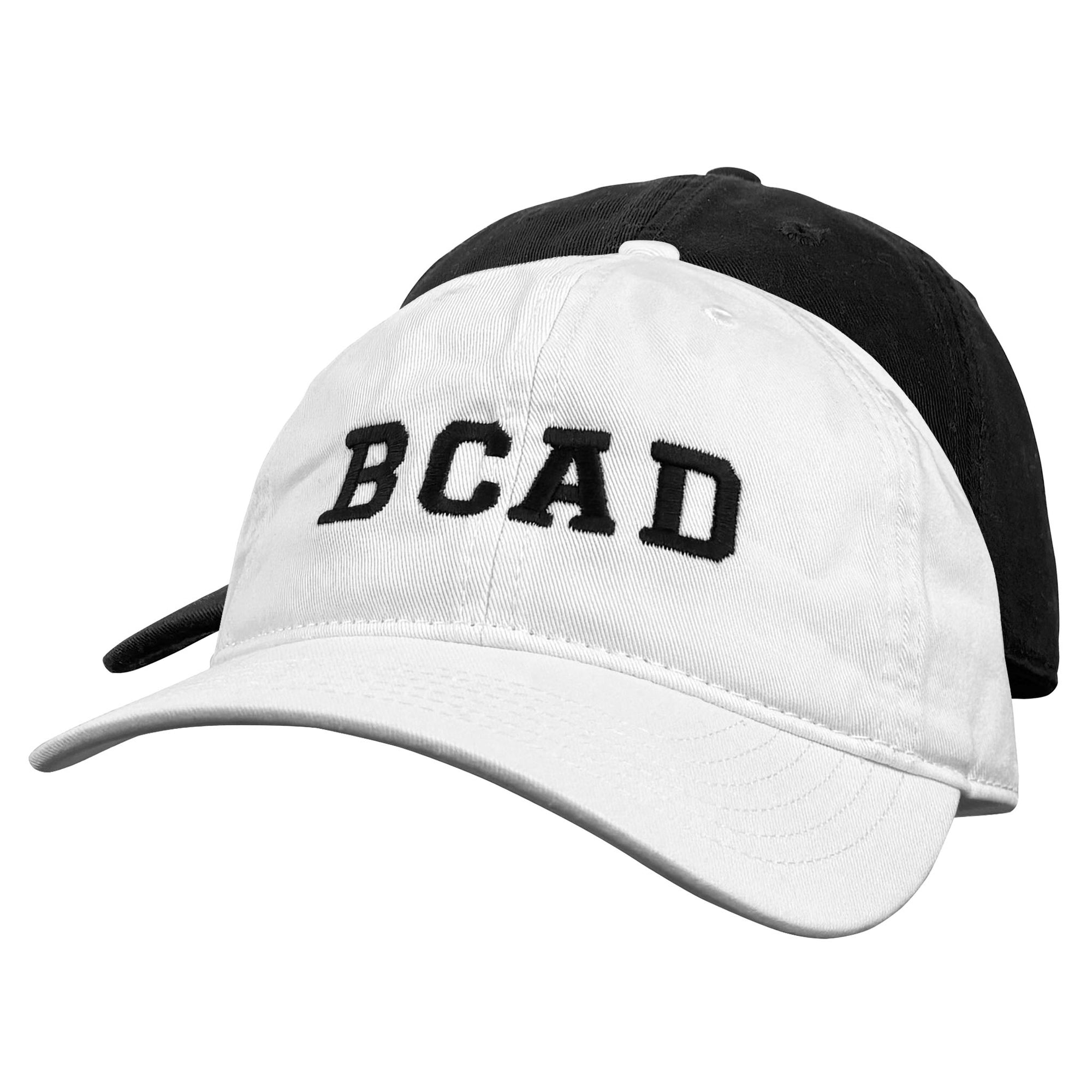 Stacked white and black baseball caps embroidered with BCAD on a white background.