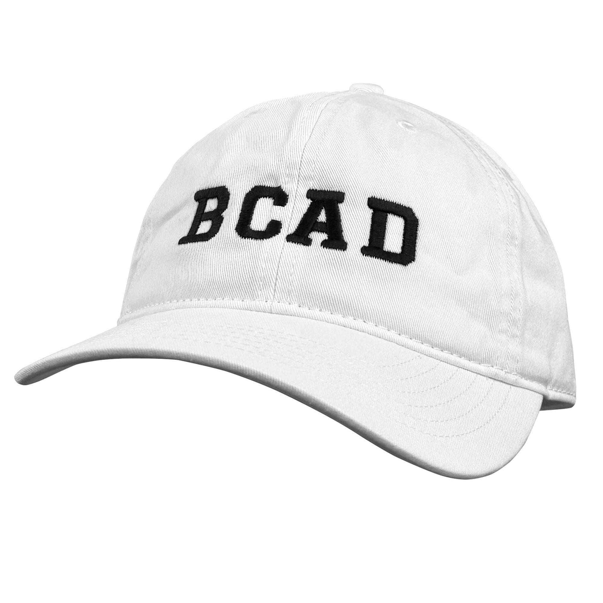 White baseball cap with BCAD embroidered on the front in black.