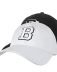 Two baseball caps, one white and one black, with a B on a white background.