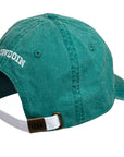 Back of green baseball cap with 'Bowdoin' logo and a white strap on a white background
