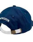 Back of navy blue baseball cap with 'Bowdoin' logo and a white strap on a white background