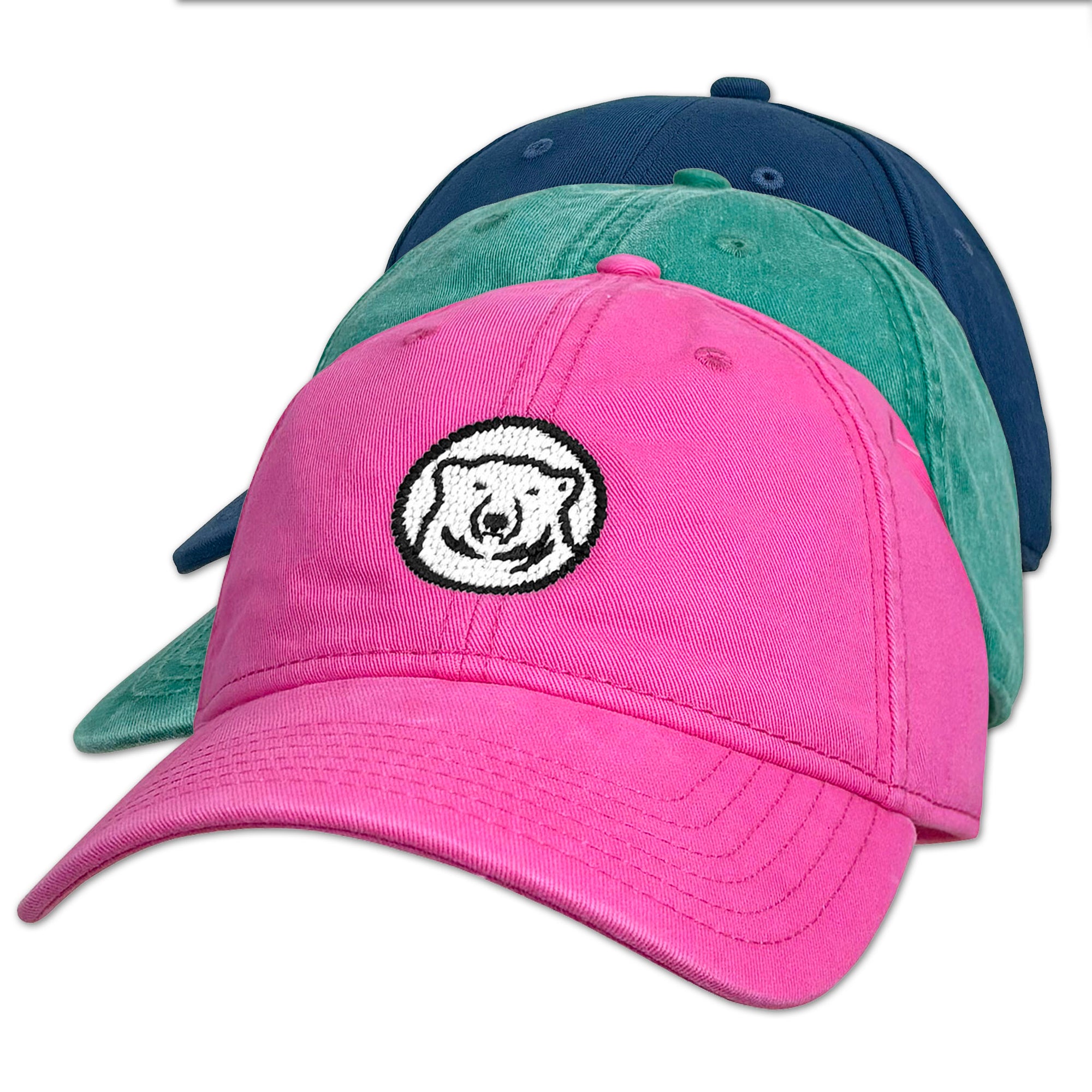 Pink, green, and navy baseball caps with polar bear logo on white background.