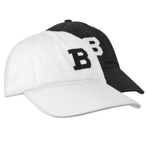 Montage of black and white S&B baseball hats.