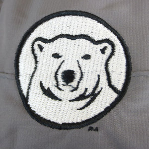 Detail of embroidered polar bear medallion on boonie hat.