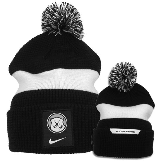 Both sides of black and white pom beanie.