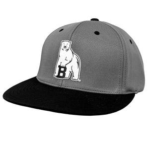 Grey hat with flat black brim, black contrast vents and button. White silicone polar bear decoration on front.