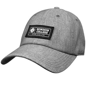 Heather grey ball cap with black rectangular patch on front with white embroidery of mascot medallion, BOWDOIN COLLEGE ESTABLISHED 1794.