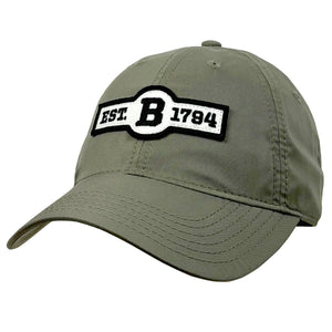 Moss green ballcap with front patch in ivory felt with black embroidery of EST. B 1794.