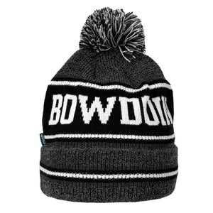 Knit cuffed beanie in marled grey with thin black and white stripes sandwiching a wide black stripe with white knit-in BOWDOIN on crown. Cuff is also marled grey with thin black-white-black stripes all around. Pom on top is black, white, and grey.,