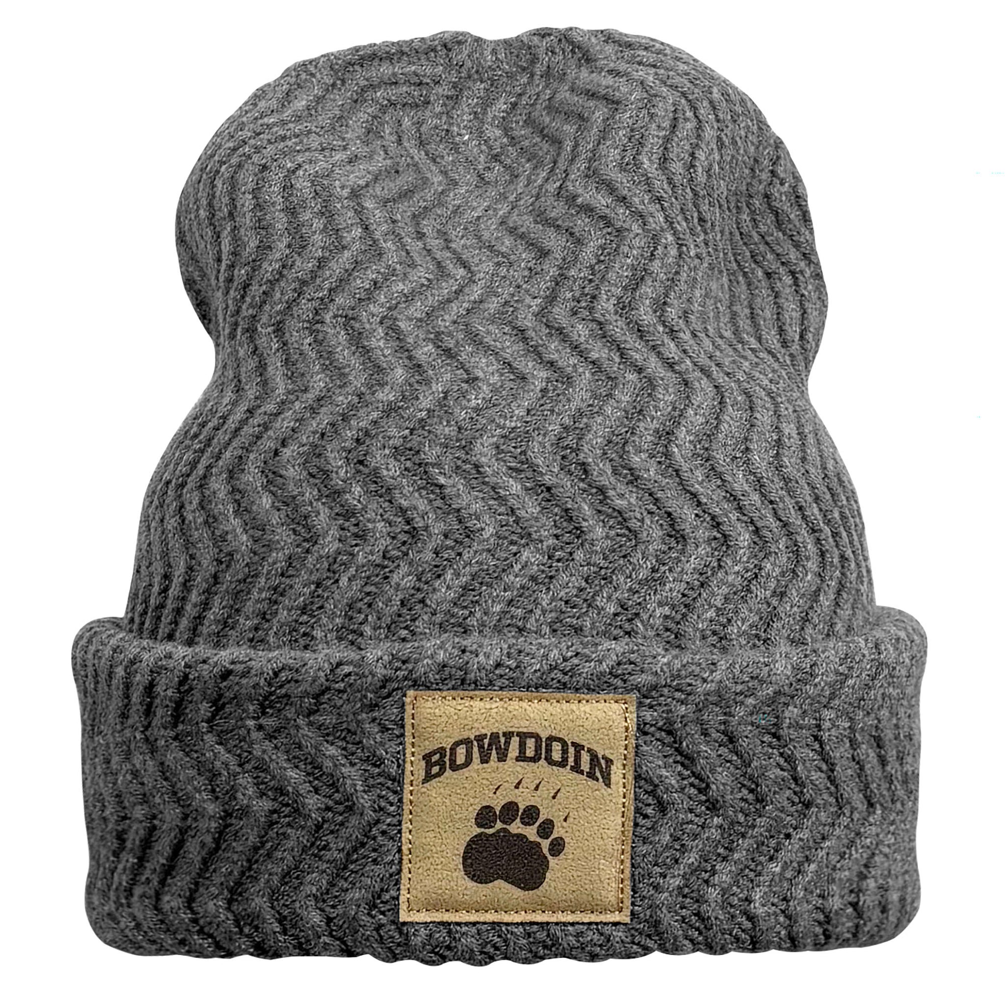 A dark gray ribbed knit beanie hat with a folded cuff, featuring a tan rectangular patch on the front with the word 'BOWDOIN' and a black paw print.