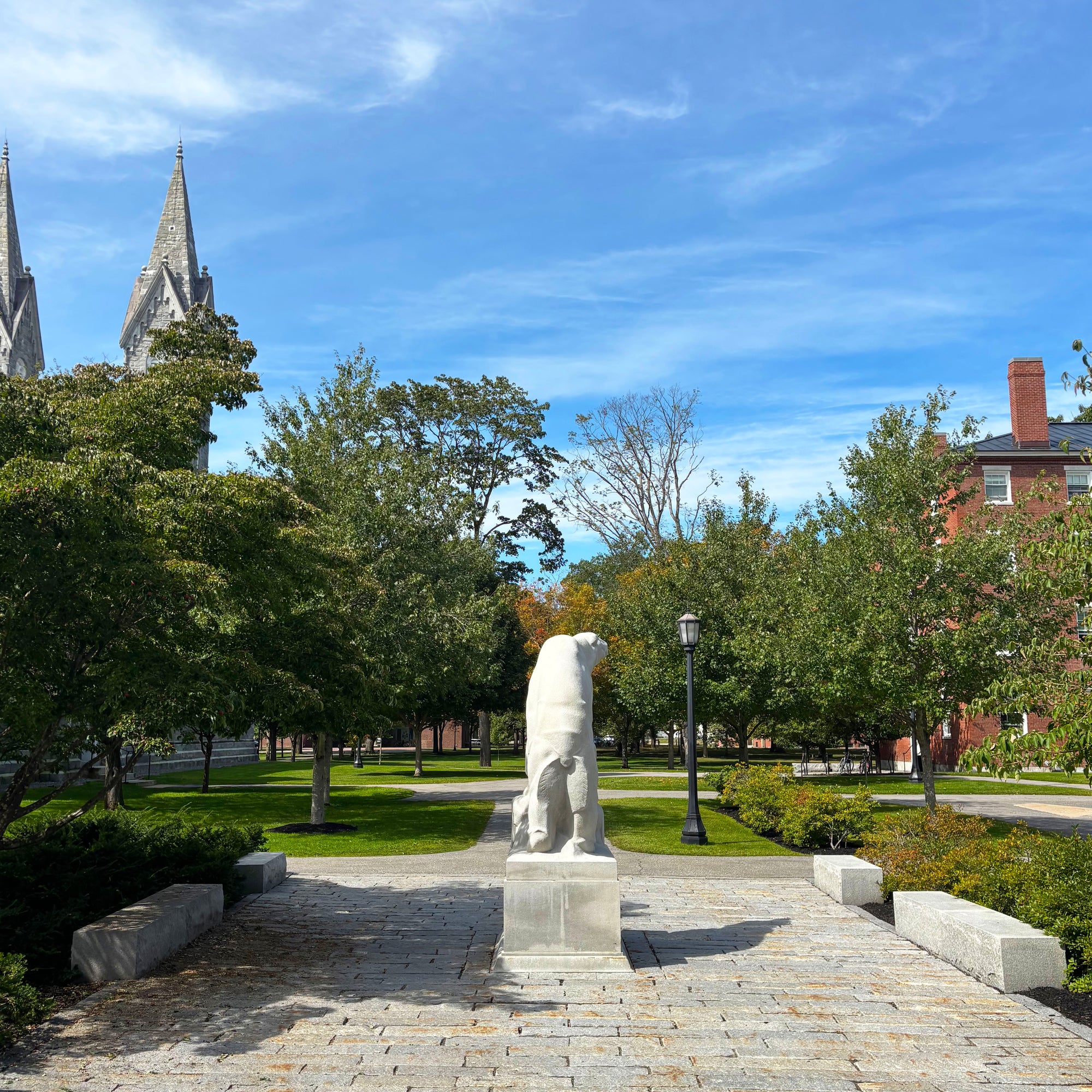 View of Hyde Plaza from the steps of Sargent Gym, showing fall color beginning on the maple trees on the Bowdoin Quad.