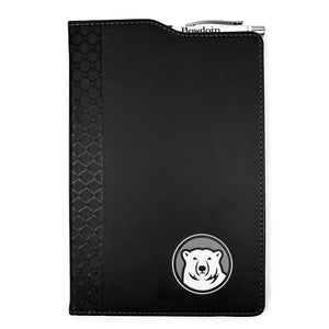 Black leatherette journal with mascot medallion imprint on lower left corner. Cutout in cover on top shows a retractable Bowdoin-imprinted pen in an elastic pen loop.