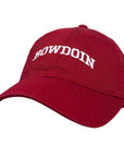 A scarlet red baseball cap with 'BOWDOIN' embroidered in white arched lettering on the front, shown against a plain white background.
