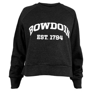 Heather black cropped sweatshirt with raglan sleeves and boxy cut. White chest imprint of BOWDOIN arched over EST. 1794 in athletic logotype.