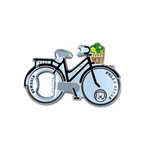 Metal bottle opener shaped like a bicycle with a basket of flowers on the handle. The wheels are decorated with BOWDOIN and POLAR BEARS with a mascot medallion.