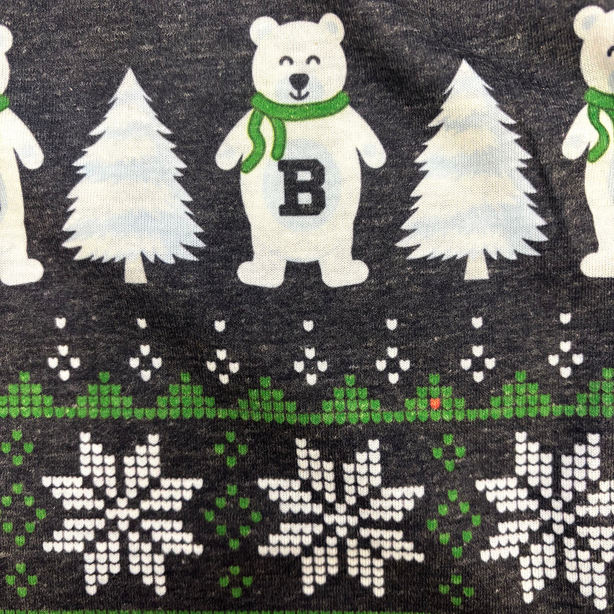 Pattern of polar bears, trees, and snowflakes on a dark gray background