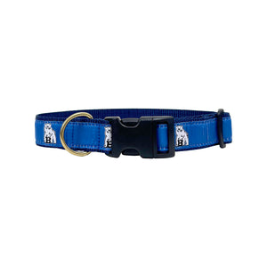 Blue dog collar with blue ribbon with repeating white Bowdoin mascot decoration. Black plastic clip closure and brass D ring.