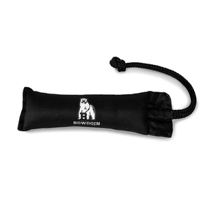 Black cushion-shaped dog toy with thick black rope attached to one end. White polar bear mascot over BOWDOIN imprint.