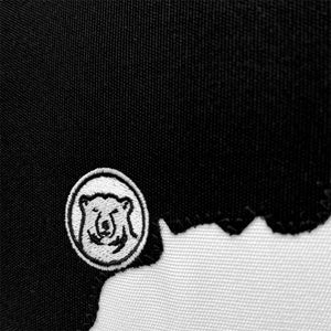 Closeup of black state of Maine applique with embroidered polar bear medallion.