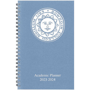 Light blue day planner with white Bowdoin sun seal imprint